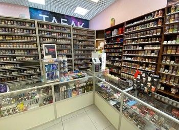 Фото Раскрученный табачный магазин в прикассовой зоне супермаркета